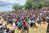 People await the distribution of food by CSI in South Sudan. csi