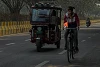 A cyclist displays a saffron flag on his bike. csi
